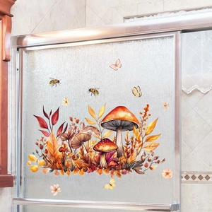 Détail de stickers de fenêtres champignons et feuilles d'automne sur verre dépoli