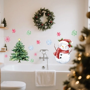 Luminous Christmas tree and snowman wall stickers decorated on a white tiled bathroom wall