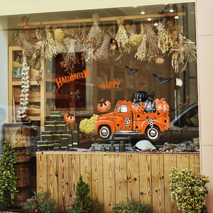 Halloween window stickers featuring an orange pumpkin truck and Happy Halloween text