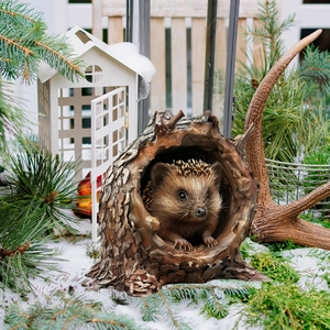 Detailed view of hedgehog garden stake with realistic resin texture and snow setting