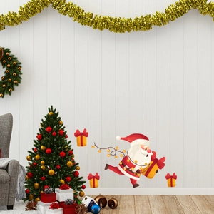 Luminous Santa Claus and gift box wall decals on white wood texture in festive home setting