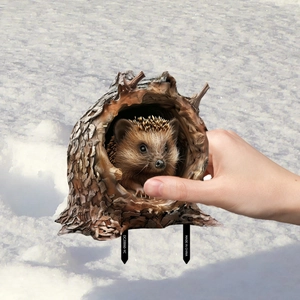 Hedgehog in a tree hollow PVC garden stake decoration displayed in snow