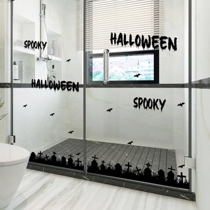 Detail of spooky black bat and cemetery silhouette window stickers for Halloween decor