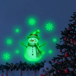 Glow-in-the-dark Christmas snowman and snowflake wall stickers in green luminous light