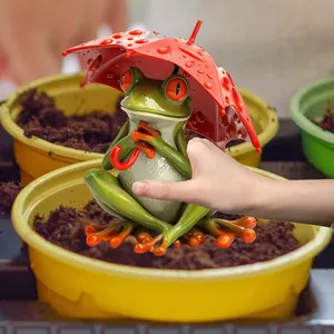 Garden stake featuring a green tree frog with a red umbrella and realistic rain textures