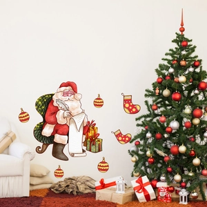 Detailed view of Santa and Christmas gift wall stickers in a cozy holiday home setting