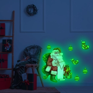 Glow-in-the-dark Christmas wall stickers featuring Santa Claus and holiday stockings