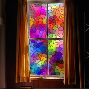 Detail of colorful mosaic flower window sticker with vibrant stained glass light effect