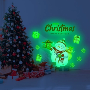 Luminous Christmas wall stickers featuring green glowing snowman, snowflakes and gift boxes