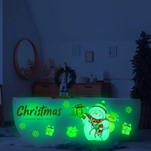 Detailed view of luminous Christmas snowman and gift wall stickers glowing in the dark