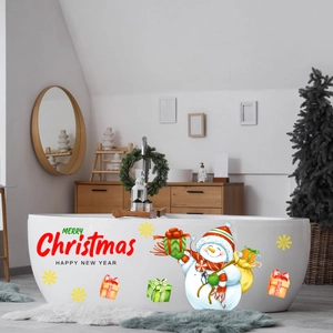 Close-up of luminous Christmas snowman and snowflake decals on a modern white bathtub