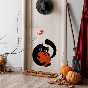 Detail of cute black cat and pumpkin window sticker on door for Halloween home decor