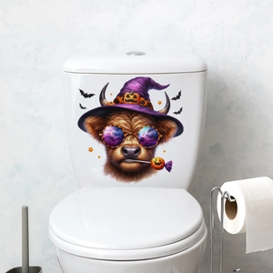 Detail view of a Halloween Highland cow wall sticker with wizard hat and glasses on a toilet lid