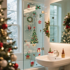 Detailed Christmas window stickers with hand-painted tree and gift box on glass surface