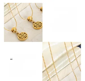 Detail of 18K gold-plated stainless steel necklace with double-sided Fu pendant
