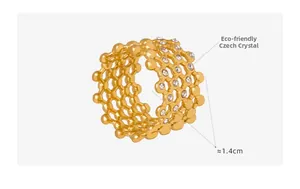 Detailed view of wide hollow mesh ring with sparkling Czech crystals in 18k gold finish
