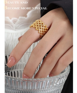 Detail of gold-plated honeycomb hollow ring with micro-paved cubic zirconia