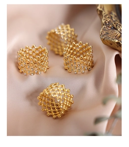 Detail of four-piece gold mesh hollow rings with inlaid Czech diamonds on silk