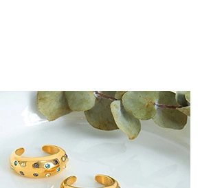 Macro detail of 18k gold plated bracelet with colorful embedded crystal gemstones