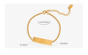 Detailed view of gold plated titanium bracelet with Happy Forever engraved rectangle tag