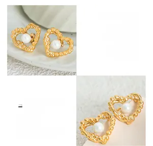 Macro detail of twisted rope heart studs with 18K gold plating and lustrous white pearl
