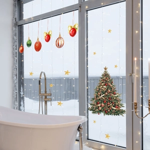 Detailed Christmas tree window clings with colorful ornaments and stars on glass