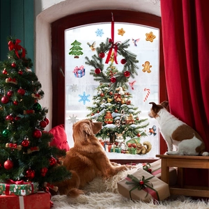 Festive Christmas tree and snowflake window decals shown in a cozy home setting with dogs