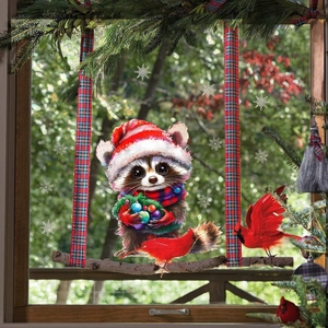 Christmas window sticker featuring hand-painted raccoon with red birds and snowflakes
