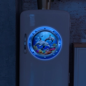 Luminous blue dolphin wall sticker glowing like a submarine window in dark room decor