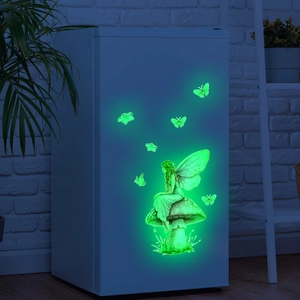Luminous wall stickers showing a glow-in-the-dark fairy on a mushroom with butterflies