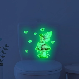 Luminous fairy on mushroom wall sticker with butterflies in bright green glow