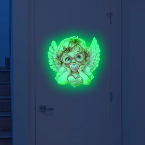 Luminous angel wall sticker with red glasses and hearts glowing green in dark bedroom