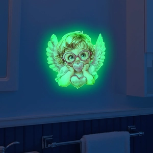 Luminous wall sticker showing a glowing angel with heart on a dark bathroom wall