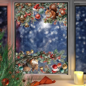 Christmas window decals with squirrels, pine branches and ornaments on a glass surface