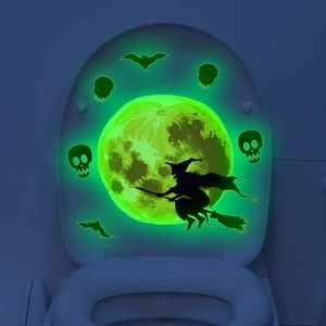 Luminous Halloween wall decal featuring a glowing green witch, full moon, and bats