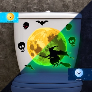 Luminous Halloween wall stickers showing contrast between daytime and green glow at night