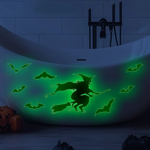Luminous Halloween wall decals featuring a green glowing witch and bats in a dark room
