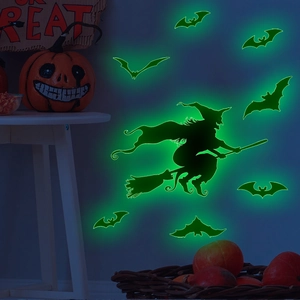 Glow-in-the-dark Halloween wall decals featuring a witch silhouette and green bats