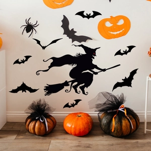 Luminous Halloween wall stickers featuring witch silhouettes, bats, and spiders on white wall