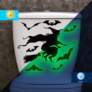 Luminous Halloween wall stickers showing daytime and nighttime green glow witch effects