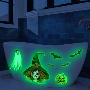 Luminous Halloween wall decals featuring glowing ghosts and bats in a dark bathroom setting