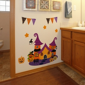 Detail of Halloween glow-in-the-dark wall decals with castle, pumpkins, and stars