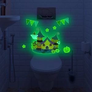 Luminous Halloween wall decals featuring a glowing castle, ghosts, and pumpkins in dark room