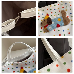 Detailed views of white tote bag showing polka dot print, plush puppy patch and hardware