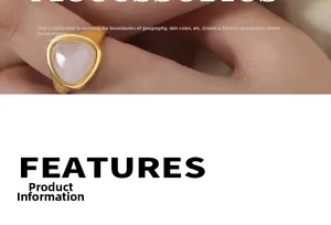 Close-up of golden ring with triangular pink stone inlay on a model finger