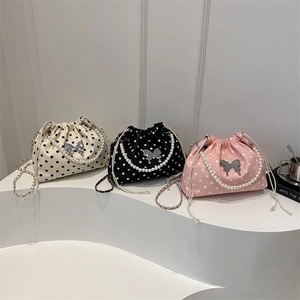 Chic polka dot bucket bags with pearl handles and butterfly charms in three colors