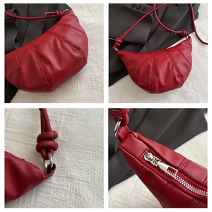 Detail shots of burgundy crescent bag featuring pleated leather and silver hardware