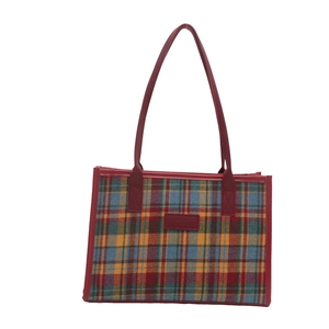 Retro vintage plaid tote bag with red leather handles and colorful tartan pattern