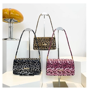 Detailed display of leopard print baguette bags in brown, grey, and pink color options