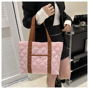 Pink quilted tote bag with brown woven handles and large capacity diamond pattern